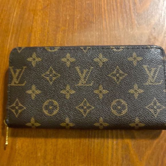 Louis, Vuitton wallet tan/brown LV on the inside and the zipper. Great condition